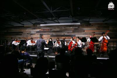 Senior Youth Orchestra perform at AMP Center for Performance and Education while conducted by